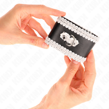 KINK - SCHWARZE HANDGELENKFESSELN MIT WEISSER VERZIERTER SPITZE, VERSTELLBAR 20-23 CM X 5,5 CM